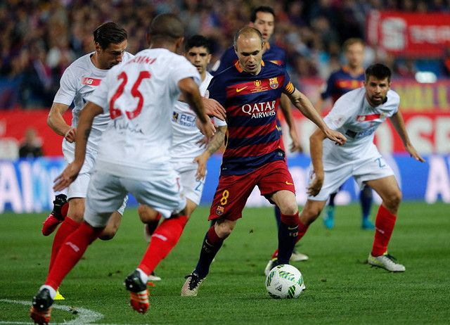 Iniesta surrounded by players of Real Madrid, Czech Republic, Croatia ...